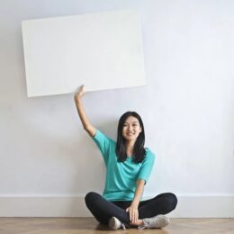 woman holding blank card