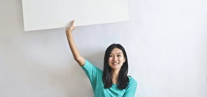 woman holding blank card